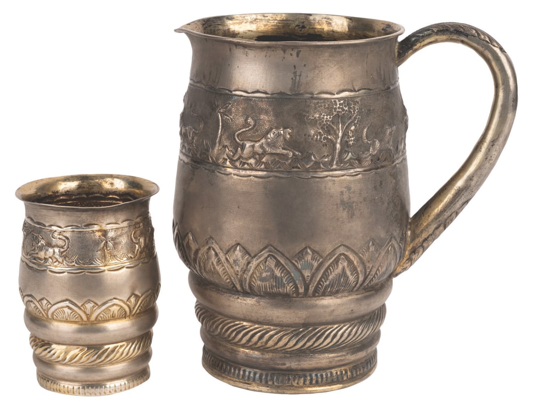 A “Game of Thrones" Dothraki Wine Jug and Cup.: (HBO, 2011-2019) A Dothraki wine jug and cup from the production of “Game of Thrones.” The ornate drinking vessels from the acclaimed fantasy series feature raised imagery of jungle animals al