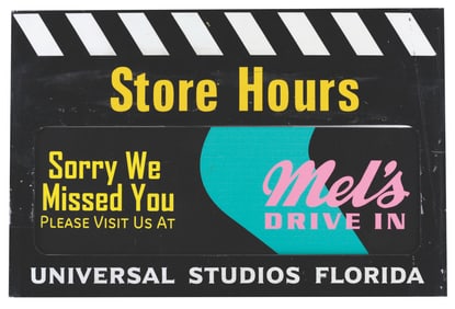 A Universal Studios Florida Store Hours Sign.