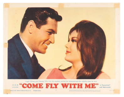 A "Come Fly with Me" Lobby Card.: (MGM, 1963) A lobby card for the romantic comedy “Come Fly With Me” featuring Hugh O’Brian and Pamela Tiffin. Measuring 11” x 14”, the lobby card displays in good condition with