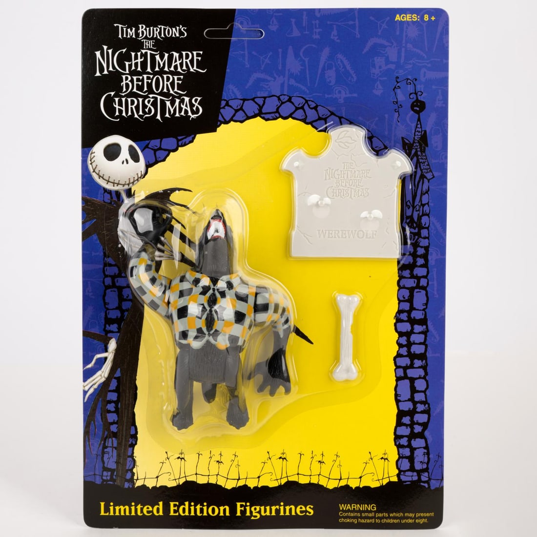 A Werewolf "Nightmare Before Christmas" Action Figure.: (NECA, 1990s-2000s) An action figure of the Werewolf from "Tim Burton's The Nightmare Before Christmas." The figure was released in an unnumbered edition of 10000 and comes with a gravestone and bone