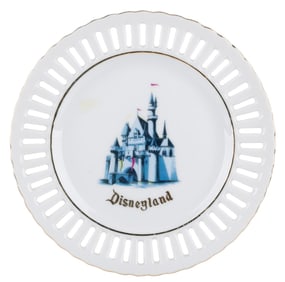 A Sleeping Beauty Castle Souvenir Lace Plate.