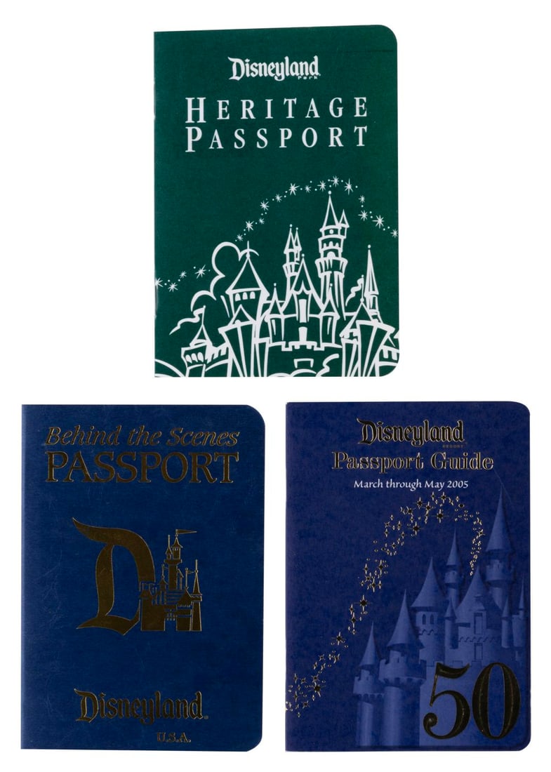 A Collection of Disneyland Passports.: (Disneyland, 2000s) A collection of three Disneyland passports. Included are a behind-the-scenes passport, a heritage passport, and a passport guide for March through May 2005. Measuring 3.5” x