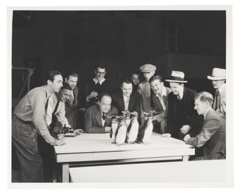 A Photo of Walt Disney with Studio Staff and Penguins.