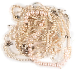 A Collection of Miss Piggy Faux Pearl Necklaces.