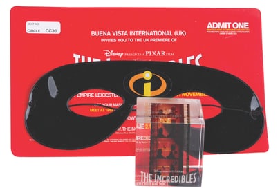 An “Incredibles" Crew Gift Paperweight & Premiere Invitation.