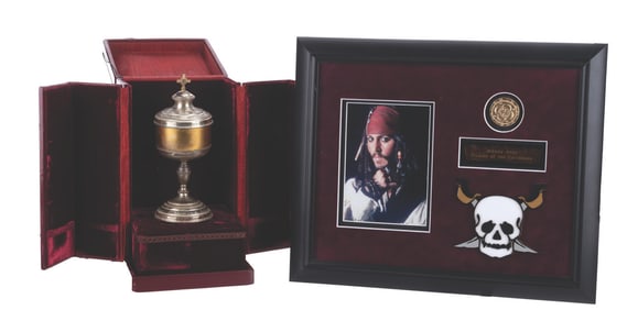 A “Pirates of the Caribbean" Prop Chalice and Doubloon.