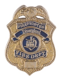 A Disneyland Fire Deptartment Badge Pin.