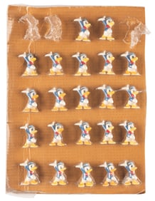 A Collection of Donald Duck Shrink-Wrapped Figures.