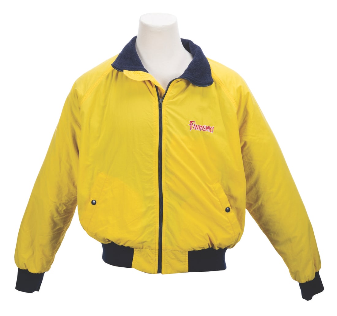 A Fantasmic! Cast Member Jacket.: (Disneyland, 1990s) A jacket worn by Disneyland Crowd Control Cast Members during the nighttime spectacular, Fantasmic! Labeled a unisex L, the jacket is in very good condition with typical light stai
