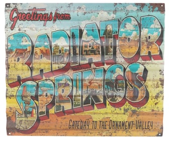 A Cars Land Souvenir Sign.