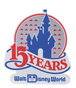 A Walt Disney World 15 Years Reflective Lamppost Sign.