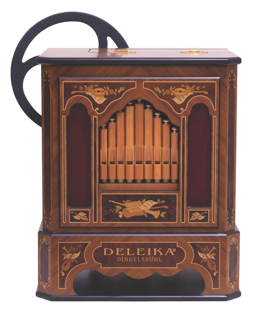 A Deleika Dinkelsbuhl Street Organ.: (Deleika, 1990s-2000s) A Deleika Dinkelsbuhl hand-cranked street organ and 17 music scrolls. Street organs were popular in Europe during the 1800s, operated by organ grinders who were sometimes accomp