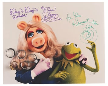 A Collection of Miss Piggy Rings and Signed Photo.