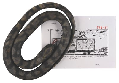 An "Indiana Jones and the Last Crusade" Prop Snake and Storyboard Page.