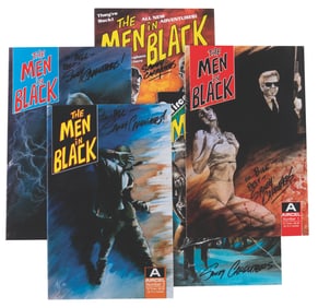 A Collection of Signed Men in Black Comic Books.