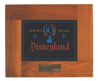 A Disneyland Tencennial Cast Member Service Award.
