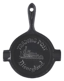 A Cast Iron Disneyland Trading Post Ashtray.