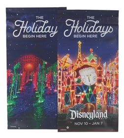A Pair of Disneyland Resort Holidays Begin Here Banners.