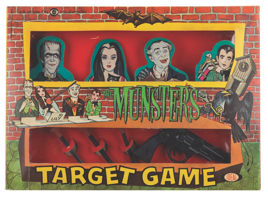 A “The Munsters" Target Game.: (Ideal, 1965) A “The Munsters” Target Game by Ideal featuring targets of Herman, Lily, Grandpa, and Eddie. Measuring 12.25" x 16.75”, the game displays in very good condition with scratc