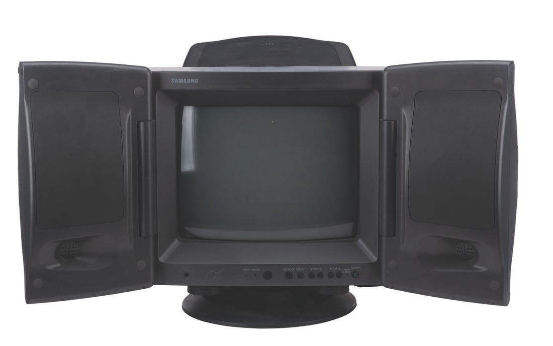 A Samsung GX 13" CRT Television.: (Samsung, 1996) A 13” Samsung CRT video gaming television. The television features swing out stereo speakers, subwoofer, dual antenna inputs, dual composite video in and one composite video out.