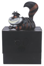 A Disney Vault Cheshire Cat Vinyl Figure.