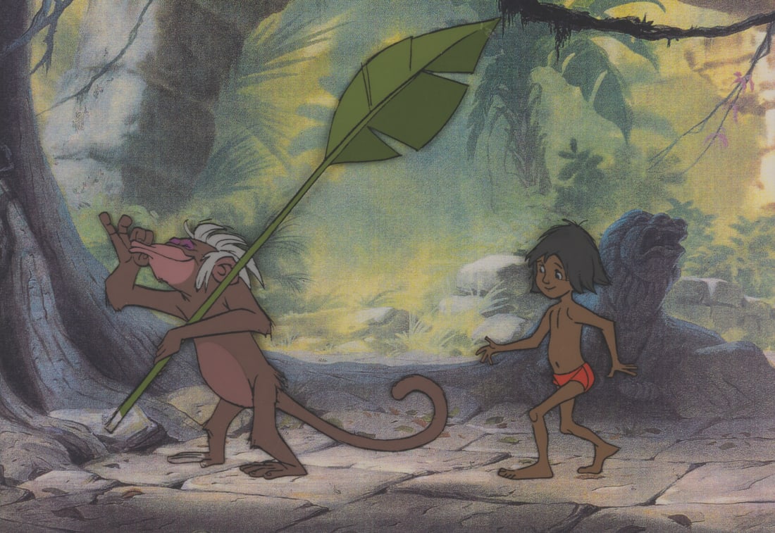 A "The Jungle Book" Original Production Cel.: (Disney, 1967) An original multi-layer production cel of a Mowgli and a monkey from “The Jungle Book.” The characters have an image size of 6.5” x 7.5” on a 7.5” x 10.75&rdqu