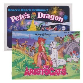 A Pair of “Pete’s Dragon" and “The Aristocats" Press Books.