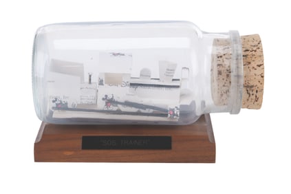 A Handmade Disney Business Card Train in a Bottle.