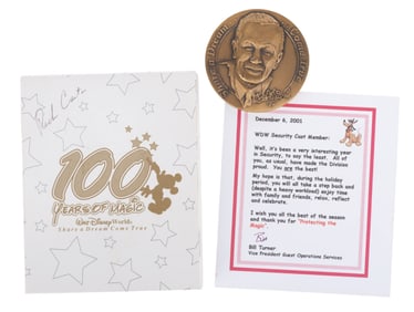 A Walt Disney World Cast Member 100 Years Medallion.