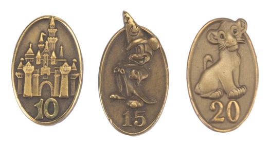 Three Cast Member Service Award Pins.