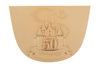 A Disneyland 50th Anniversary Plaque Production Sample.