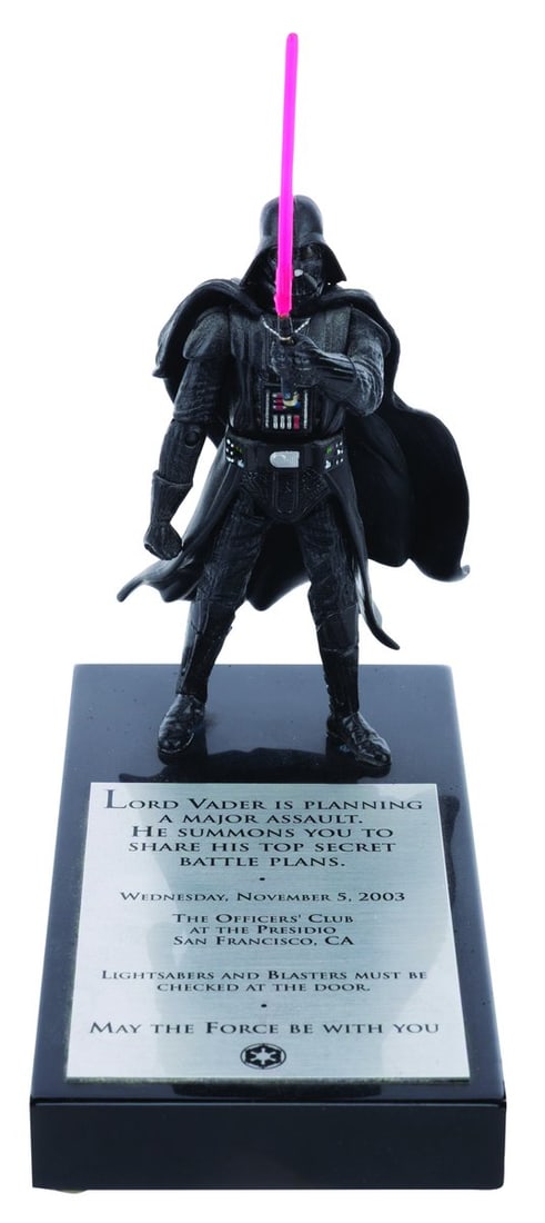 A 2003 Star Wars Summit Darth Vader Invitation.: (Lucasfilm, 2003) A rare Darth Vader action figure on a plaque, sent to merchandising licensees and Lucasfilm staff as an invitation to the 2003 Star Wars Summit at The Presidio in San Francisco. The