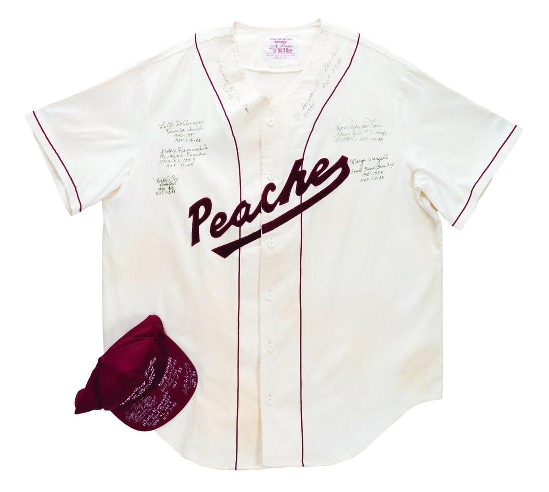 A Multi-Signed “A League of Their Own" Jersey & Hat.: (Columbia, 1992) A multi-signed "A League of Their Own" cast and crew Rockford Peaches jersey and Legendary Ladies of Baseball Hall of Fame '88 hat. Signatures include those of real-life All-American
