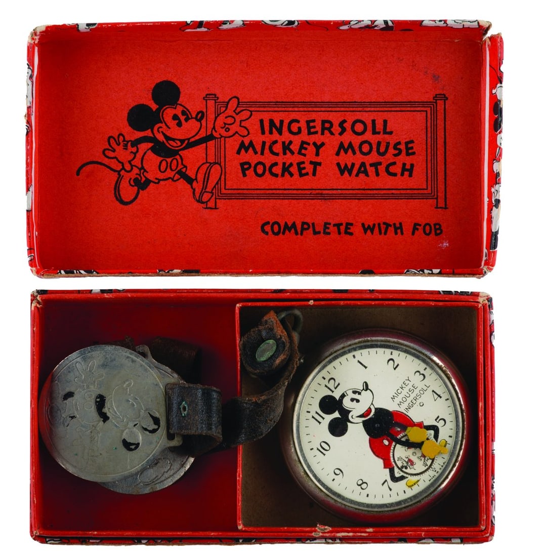An Ingersoll Mickey Mouse Pocket Watch with Fobs.: (Ingersoll, 1934) A rare early Ingersoll Mickey Mouse pocket watch with the original box, strap, and fob featuring a Mickey engraving, as well as an additional fob with strap. The watch did not work w
