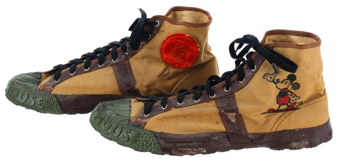 A Rare Pair of Mickey Mouse Converse Skoots Sneakers.: (Converse, 1930s) A very rare pair of Mickey Mouse Skoots sneakers manufactured by Converse, the first producer of licensed cartoon character shoes. These canvas and rubber high-top sneakers are an in