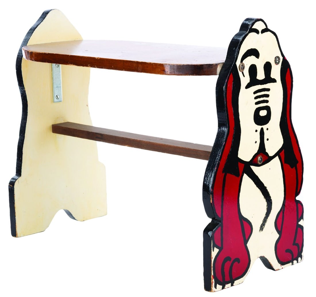 A Kroehler Pluto Desk Bench.: (Kroehler, 1930s) A rare children's desk bench manufactured by Kroehler, featuring Pluto's front on one side and his tail end on the other. Measuring 22" x 9.5" x 17.5" tall, the desk bench is in good