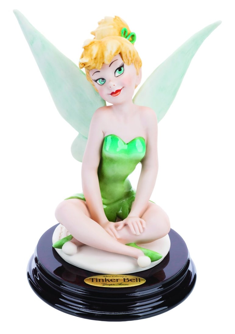 A Tinker Bell Figurine by Giuseppe Armani.: (Armani, 2004) A fine art Tinker Bell figurine by artist Giuseppe Armani. Measuring 6" x 6.25" tall, the figurine is in fine condition and is accompanied by its Certificate of Authenticity and origina