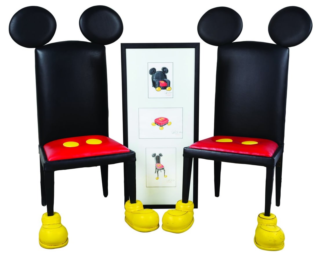 A Rare Pair of Mickey Mouse Chairs and Original Concept Art.: (Disney, 1994) An incredibly rare pair of Mickey Mouse chairs and their original framed concept drawings. Designed by Disney artist Paddy Gordon, these leather-upholstered pine chairs incorporate Mick