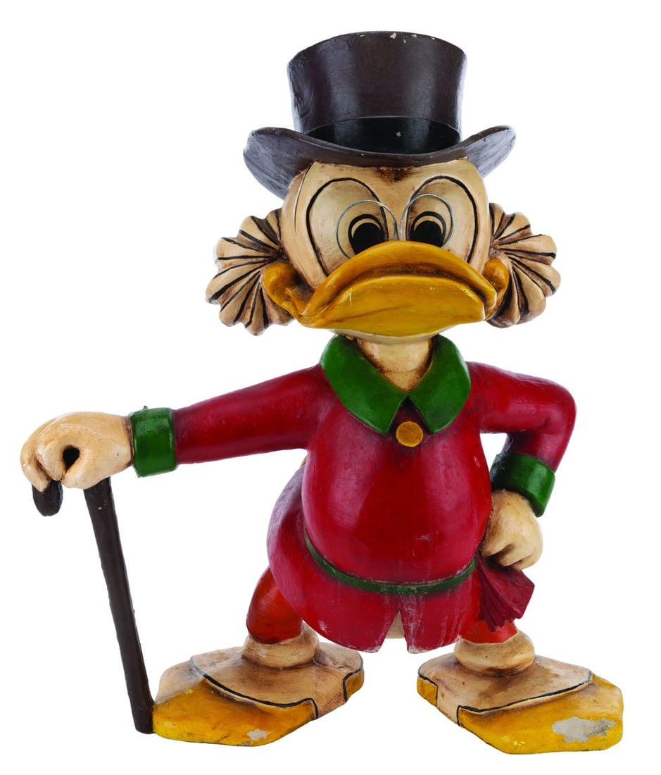A Scrooge McDuck Figure.: (1960s-80s) A heavy hand-painted Scrooge McDuck figure. The figure appears to be made of heavy plaster or fiberglass-like material and has been intentionally aged. Measuring 13" x 22" x 24" tall,