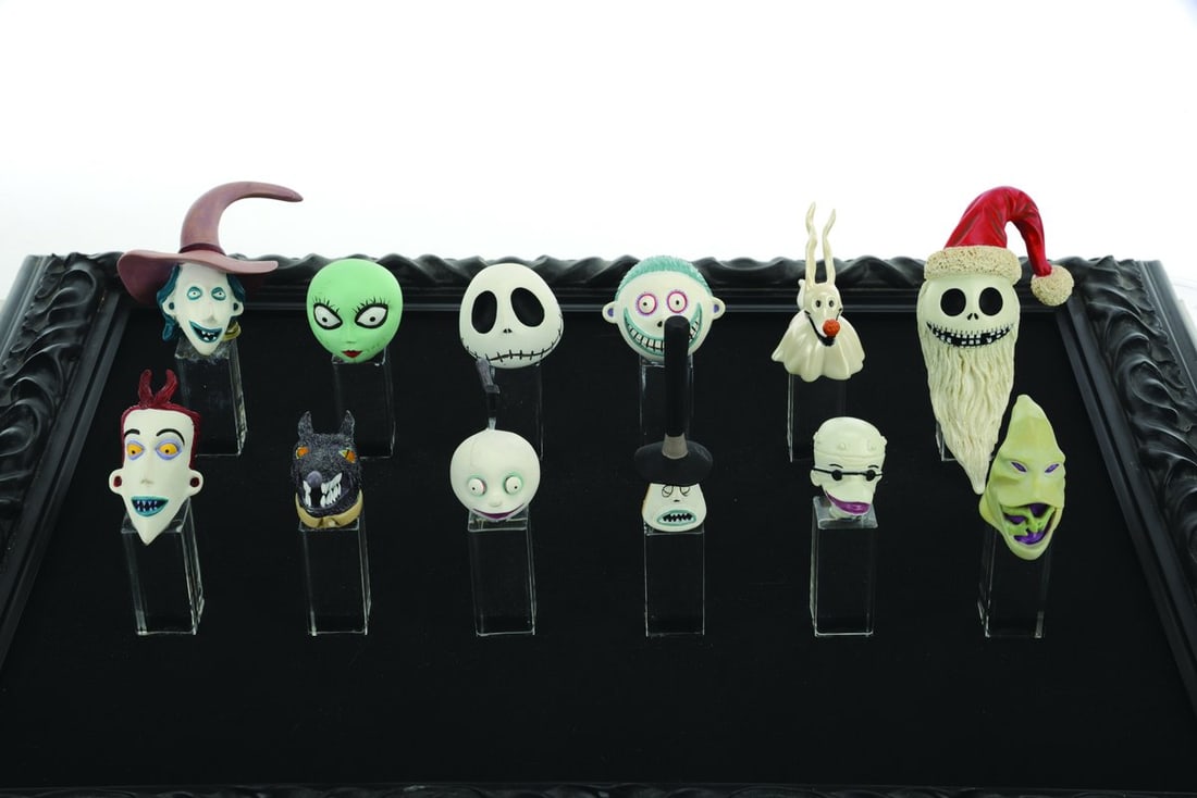 A Many Faces of "The Nightmare Before Christmas" Set & Display.: (Disney, 2000s) A set of twelve resin heads of “The Nightmare Before Christmas” characters. Originally released boxed in a limited edition of 1500, this set is presented in a custom-built disp