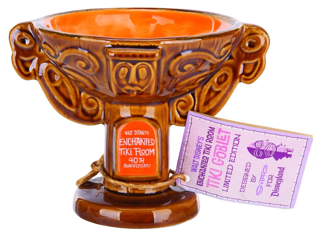 A SHAG Enchanted Tiki Room 40th Anniversary Goblet.: (Disneyland, 2003) A goblet designed by SHAG for the 40th anniversary of Walt Disney's Enchanted Tiki Room. Released in a limited edition and numbered 273/500, the mug is signed on the tag by SHAG. Me