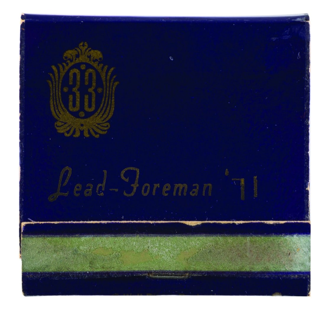 A 1971 Club 33 Lead Foreman Matchbook.: (Disneyland, 1971) A complete Club 33 matchbook with "Lead-Foreman '71" on one side, likely given to a Cast Member working in that position at the time. Measuring 2" x 2", the matchbook displays in go