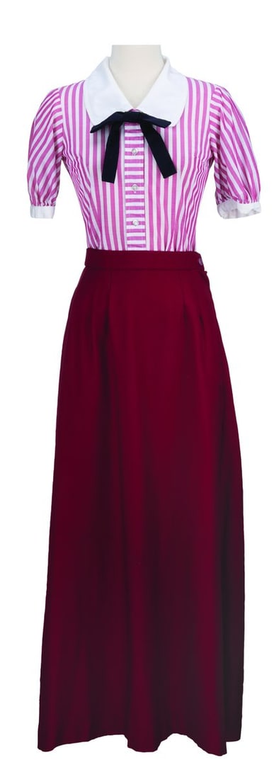 A Geppetto's Arts & Crafts Cast Member Costume.: (Disneyland, 1980s) A costume shirt and dress worn by Cast Members working at Geppetto's Arts & Crafts in Fantasyland. The shirt is labeled a size 8 and the skirt a size 10, both displaying in very go