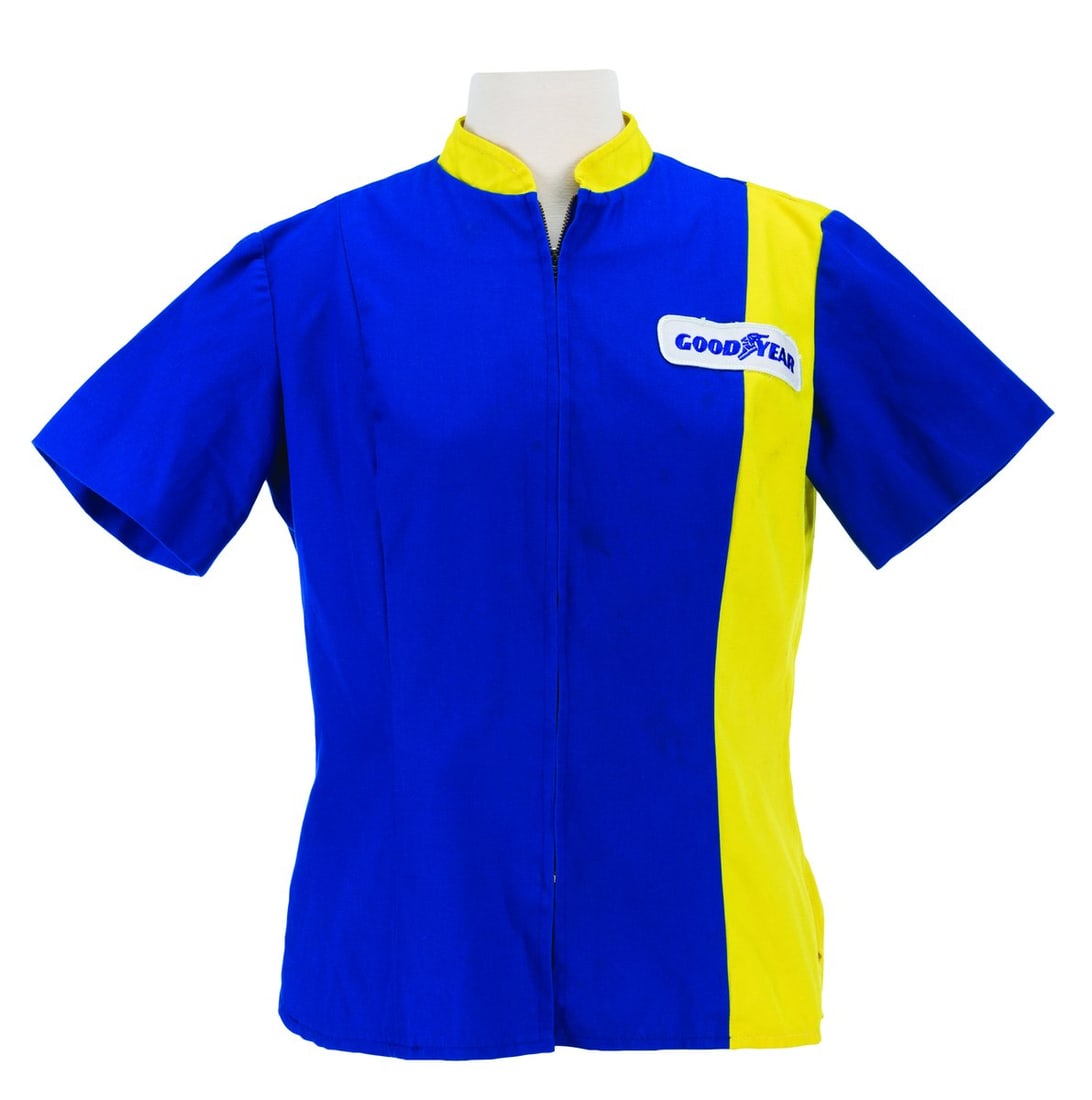 A Grand Prix Raceway Cast Member Shirt.: (Walt Disney World, 1994-2009) A costume hat worn by Cast Members working the Tomorrowland Transit Authority in the Magic Kingdom. Labeled a size Large 7 ? - 7 ??, the hat is in very good condition wi