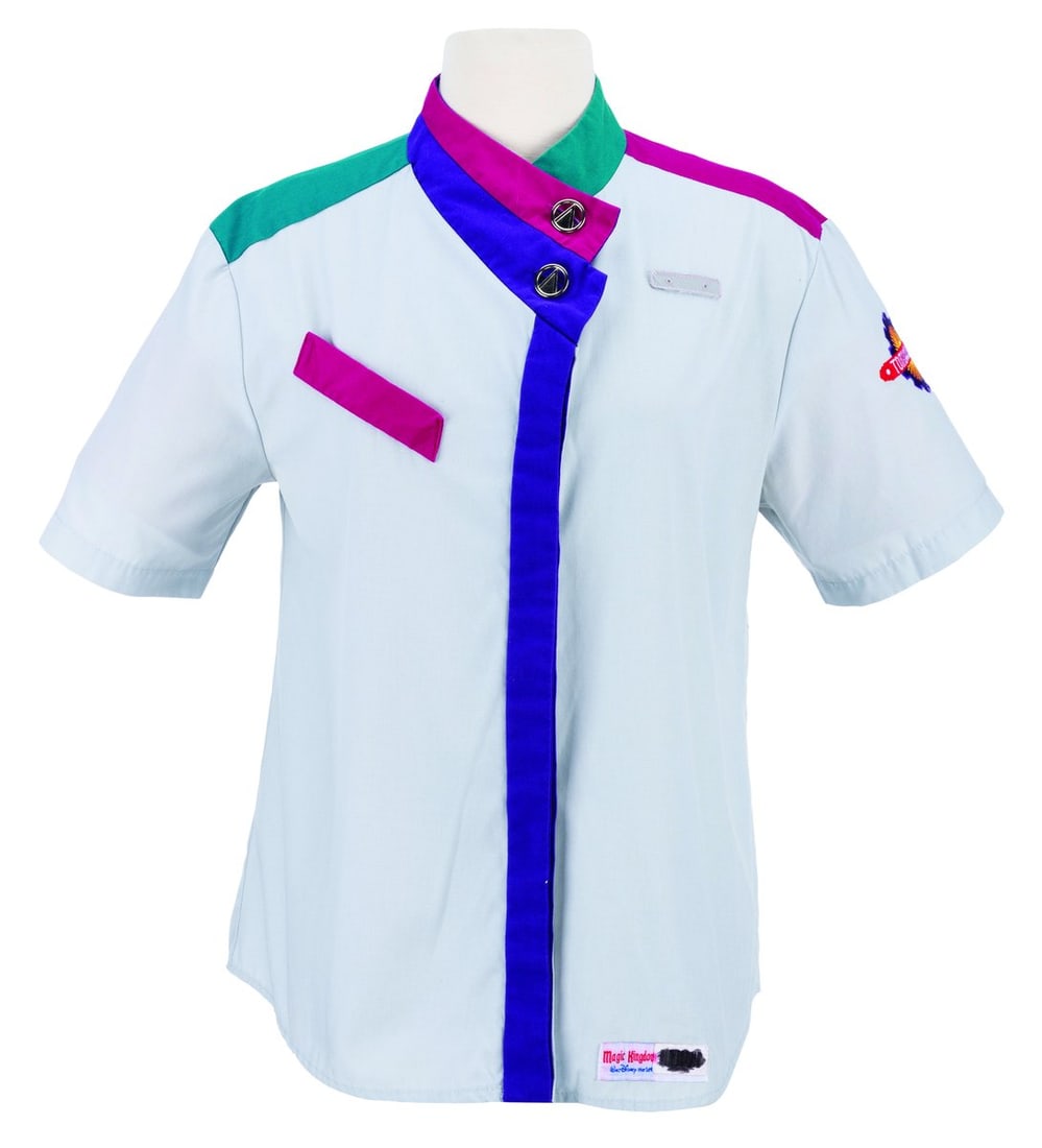 A Tomorrowland Cast Member Costume Shirt.: (Walt Disney World, 1990s-2000s) A costume shirt worn by Cast Members in Tomorrowland. Labeled a size 14, the shirt is in very good condition with light wear from Park use.