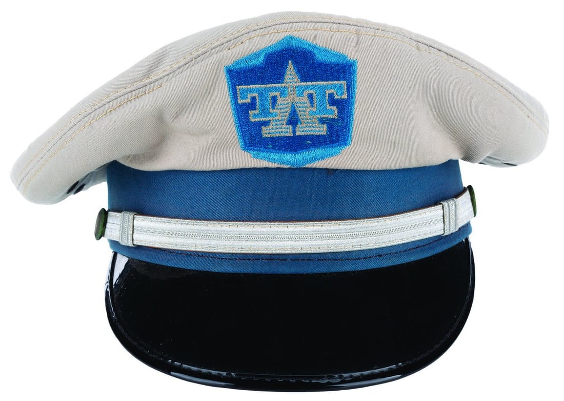 A Tomorrowland Transit Authoriy Costume Hat.: (Walt Disney World, 1994-2009) A costume hat worn by Cast Members working the Tomorrowland Transit Authority in the Magic Kingdom. Labeled a size Large 7 ? - 7 ??, the hat is in very good condition wi