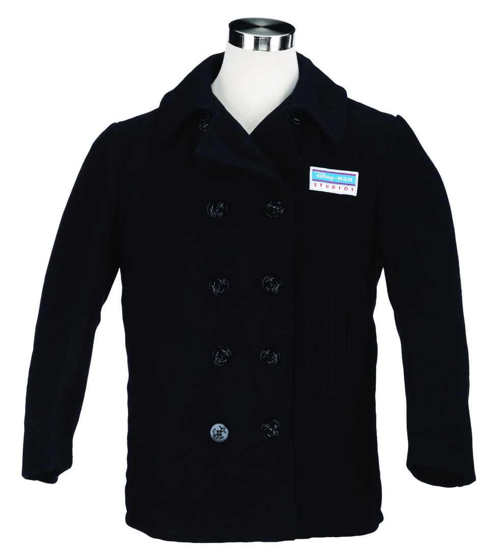 A Disney-MGM Studios Cast Member Peacoat.: (Disney-MGM Studios, 1990s-2000s) A black peacoat worn by Cast Members at Disney-MGM Studios. Labeled a size 42, the peacoat is in very good condition with light pilling and wear.
