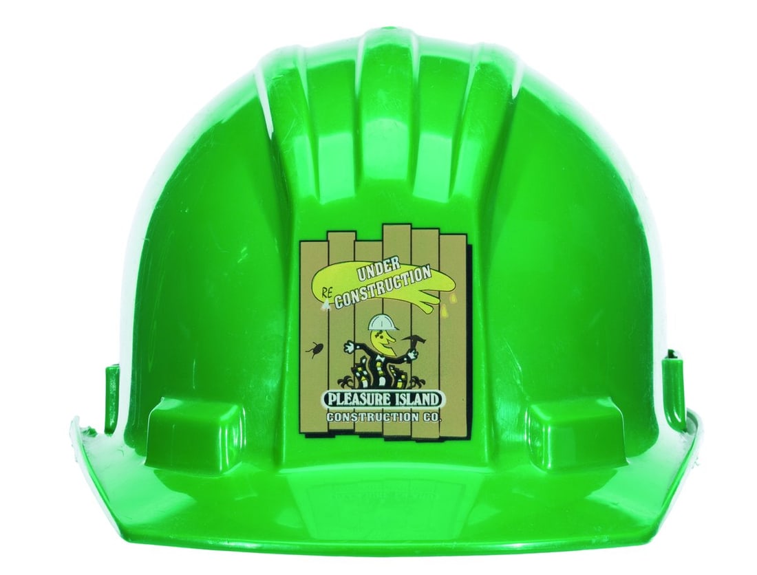 A Pleasure Island Construction Hard Hat.: (Walt Disney World, 1980s) A construction hard hat worn by the crew building the adult-focused entertainment district Pleasure Island. Unlabeled, the hard hat displays in good condition with scratches