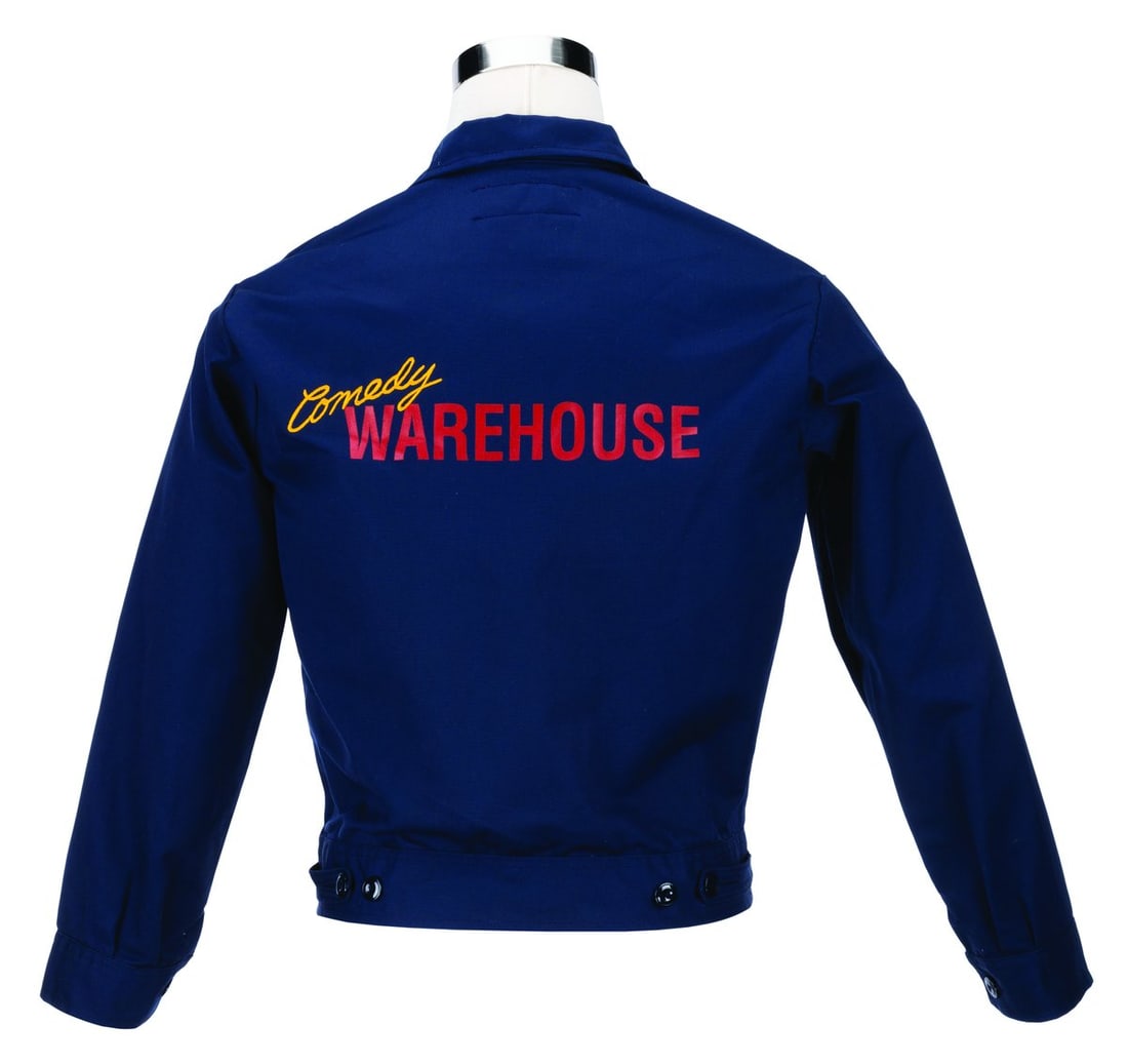 A Pleasure Island Comedy Warehouse Jacket.: (Pleasure Island, 1989-90s) A uniform jacket worn by Cast Members working at Pleasure Island’s Comedy Warehouse in Walt Disney World. Unlabeled but likely a size medium, the jacket is in very good c
