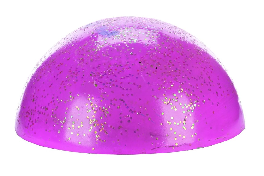 A Cinderella Castle 25th Anniversary Gumdrop Button Prop.: (Walt Disney World, 1996) A large pink gumdrop button prop originally displayed on Cinderella Castle at the Magic Kingdom. For the Resort's 25th anniversary, the castle was reskinned to resemble a gia